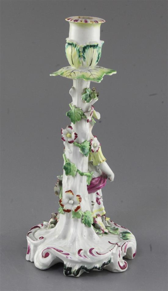 A Derby Pale Family candlestick figure, c.1756-8, h. 25cm, losses to flowers and drip pan